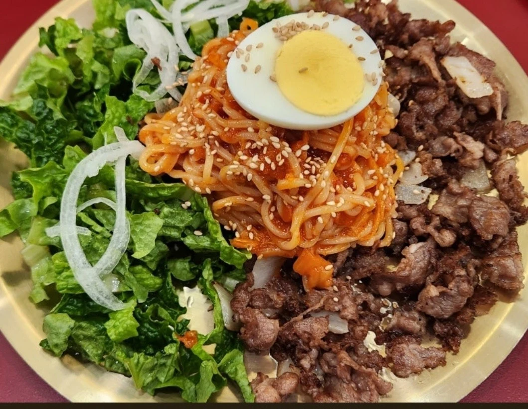 Bulgogi with spicy noodles, egg and vegetables at Garyeonhan Bueok.