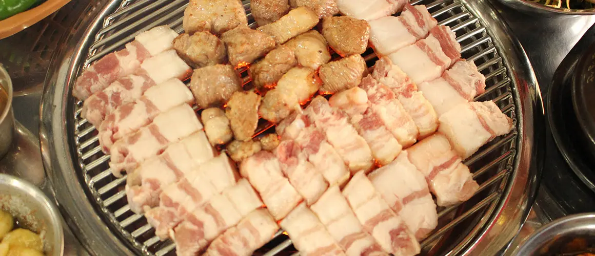 Historical pork grilling at Heukdonhyang; capture date unknown.