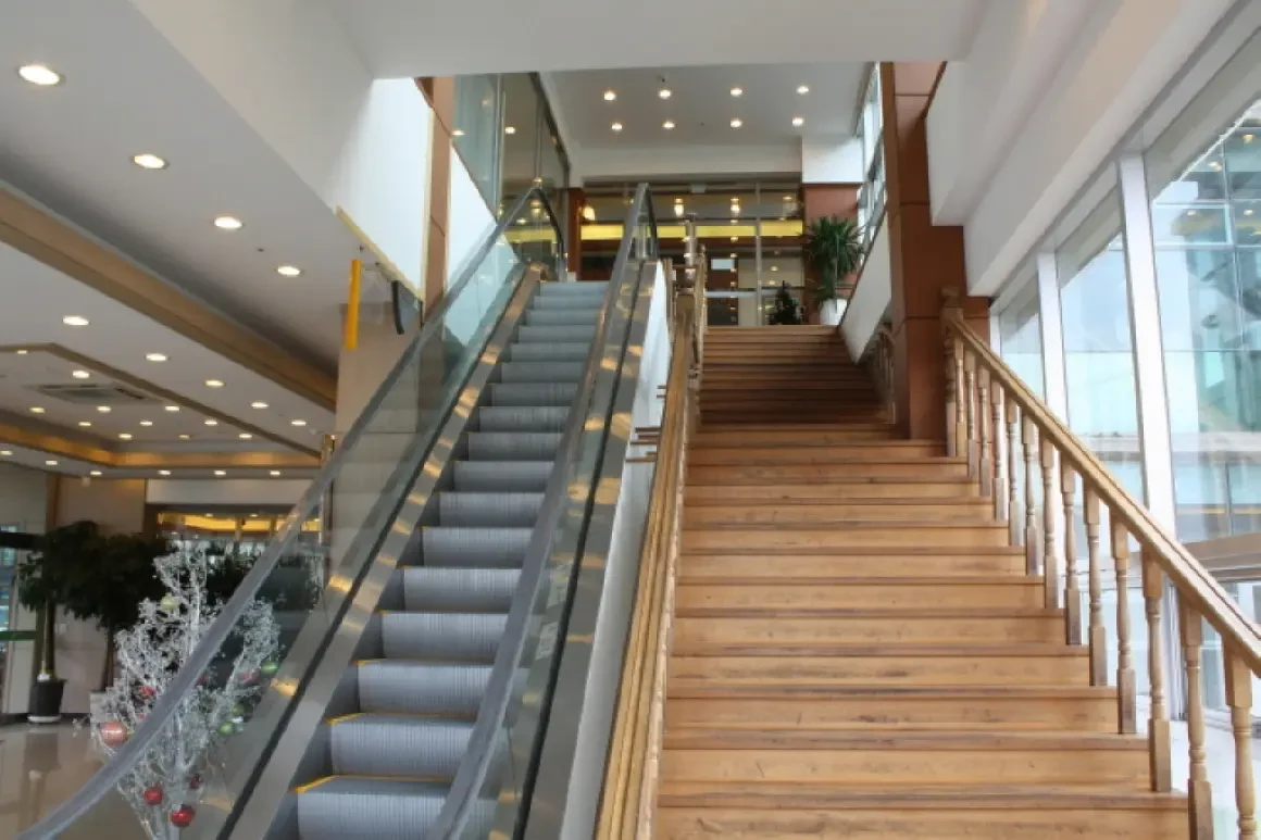 Historical Neulbom Black Pork dining space with escalator and staircase.