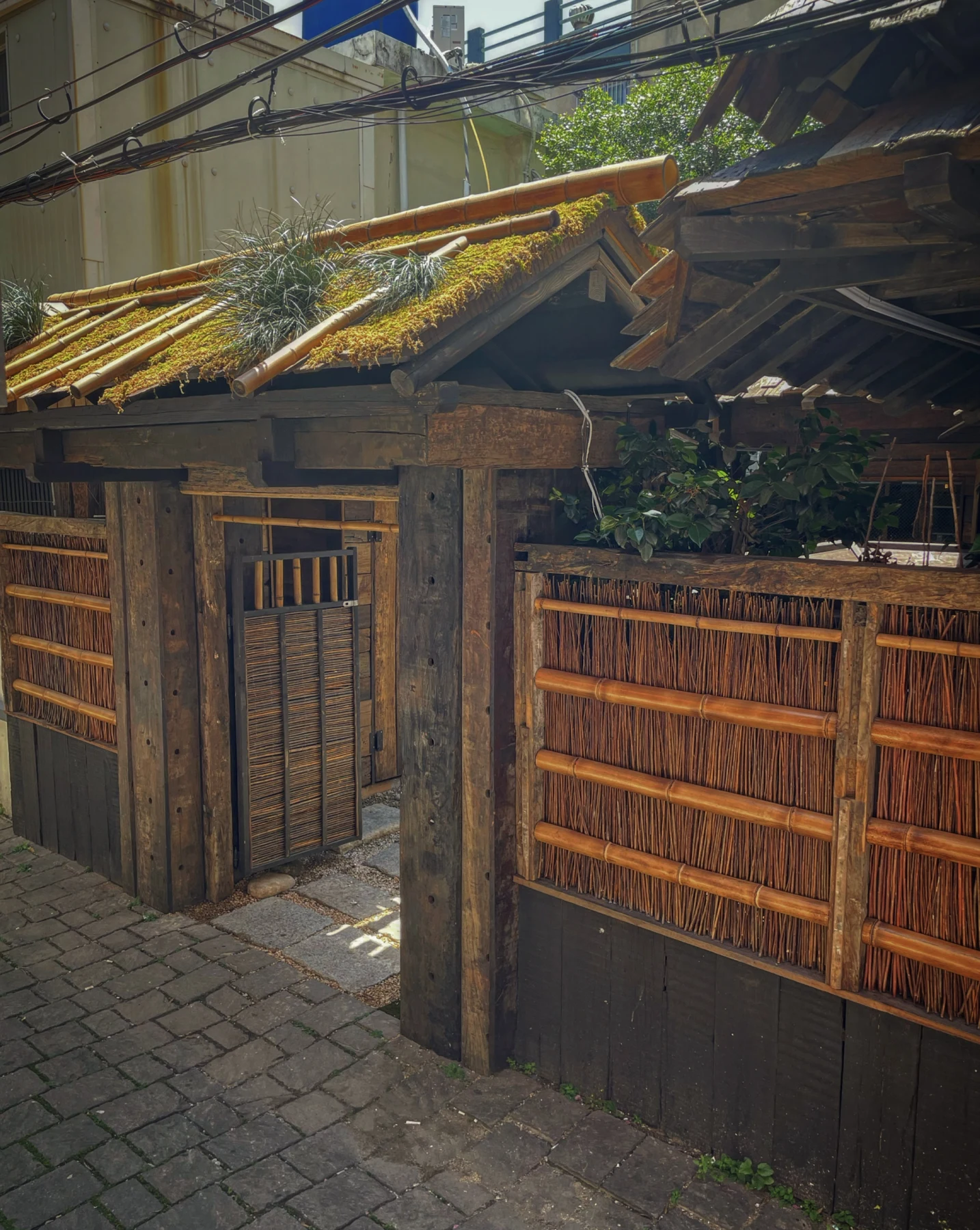 Old Mansion Seomyeon Jeonpo's timber-and-bamboo exterior; photograph date unknown.