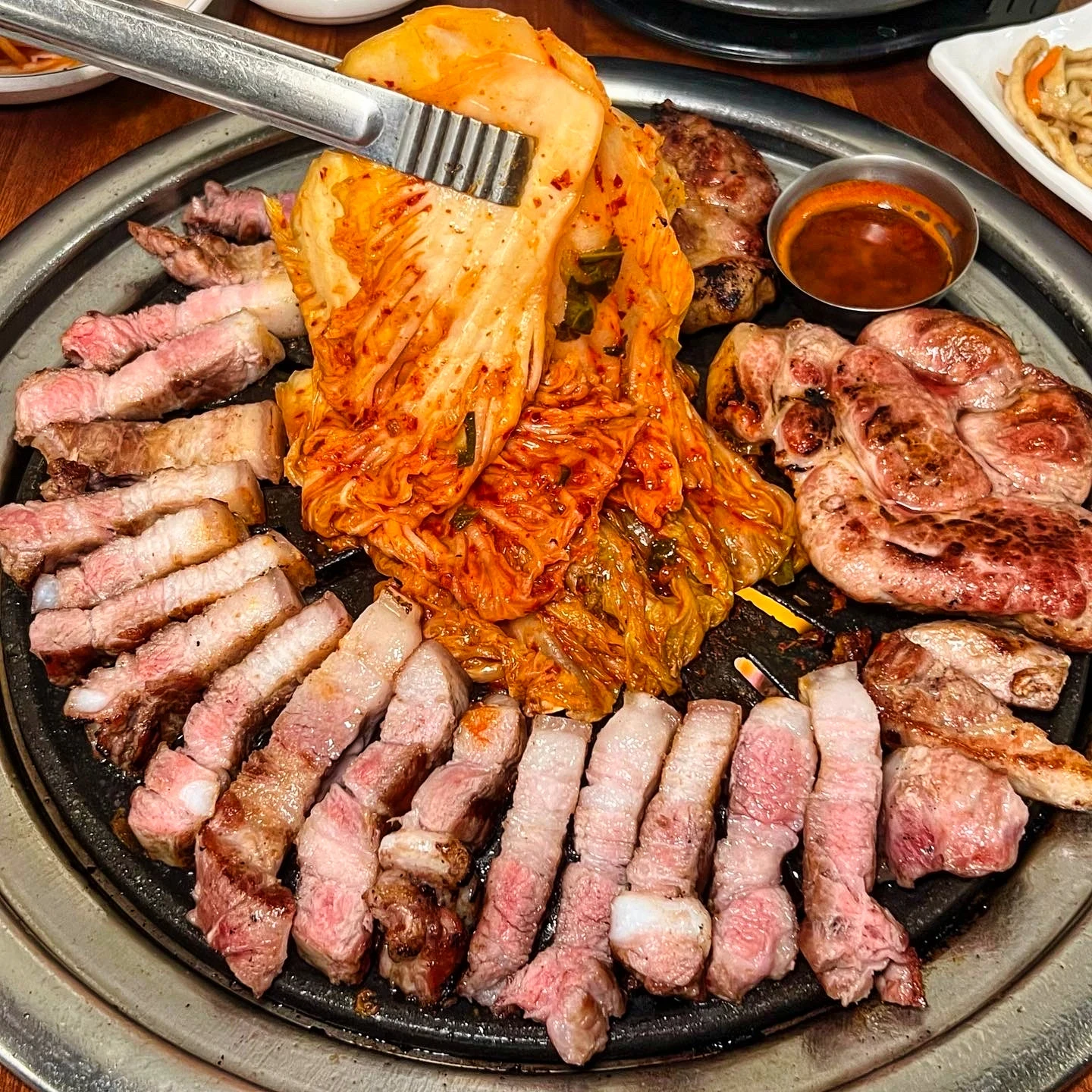 Grilled pork belly and aged kimchi at Pungnyeon